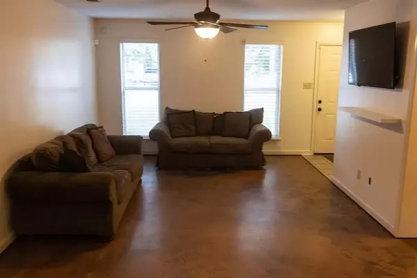 a view of an empty room with glass door