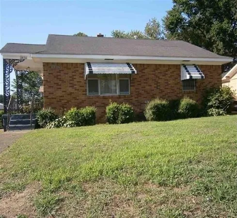 front view of a house with a yard