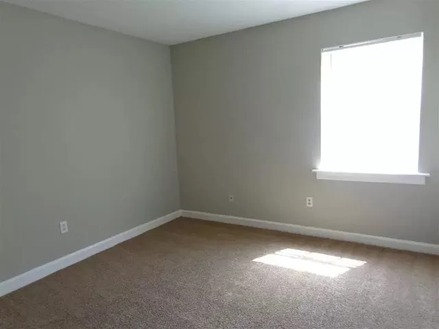a view of kitchen with entryway sink and cabinets