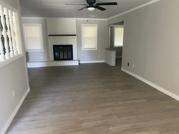 a view of kitchen with entryway sink and cabinets