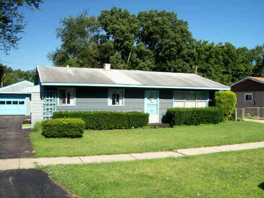 7902 Randy Road Machesney Park, IL 61115 - Photo 1 of 5 a front view of a house with a yard