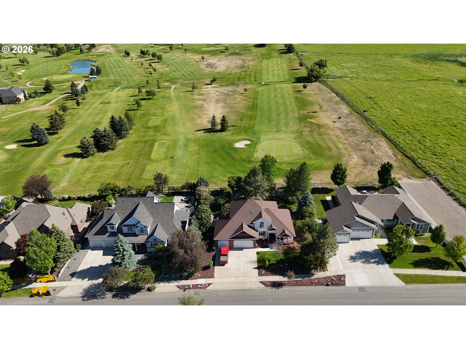 3555 Indiana Avenue Baker City, OR 97814 - Photo 2 of 43 an aerial view of residential houses with outdoor space and swimming pool