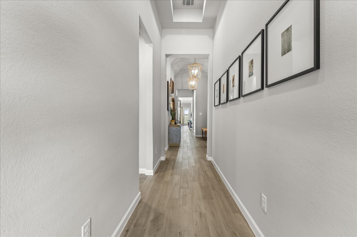 4910 Morrison Drive Manvel, TX 77578 - Photo 16 of 35 a view of a hallway with wooden floor and entryway