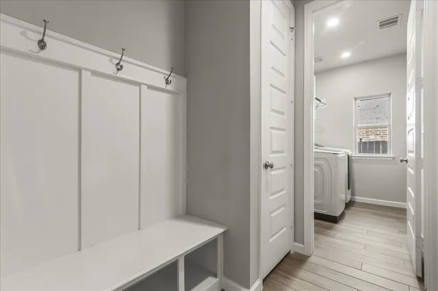 a bathroom with a shower and a sink
