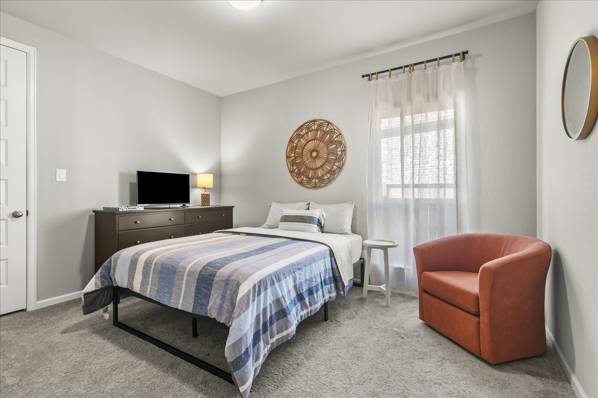 4910 Morrison Drive Manvel, TX 77578 - Photo 23 of 35 a bed room with a bed and a couch