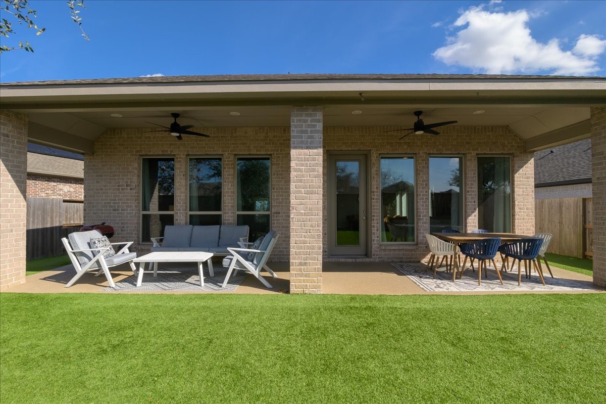 4910 Morrison Drive Manvel, TX 77578 - Photo 28 of 35 a view of a chairs and table in a patio