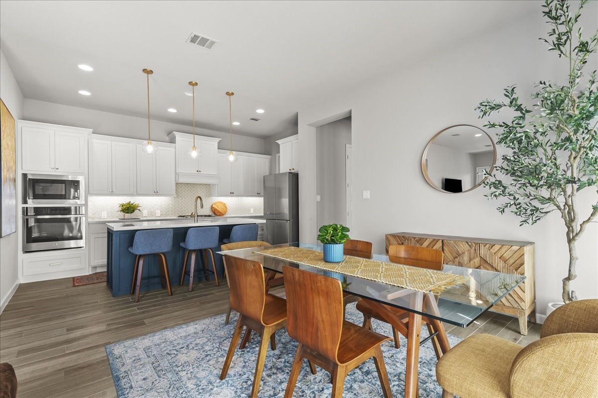 4910 Morrison Drive Manvel, TX 77578 - Photo 5 of 35 a living room with kitchen island furniture and a dining table