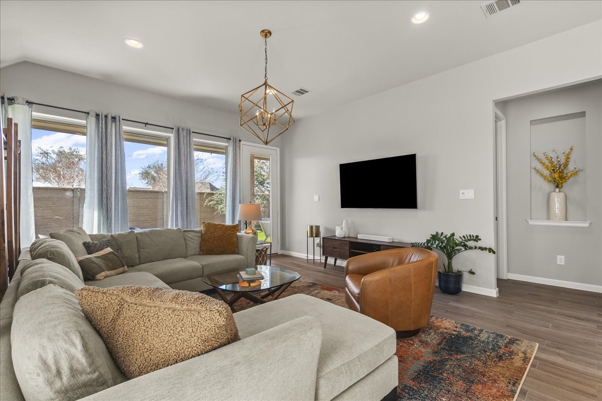 4910 Morrison Drive Manvel, TX 77578 - Photo 7 of 35 a living room with furniture flat screen tv and wooden floor