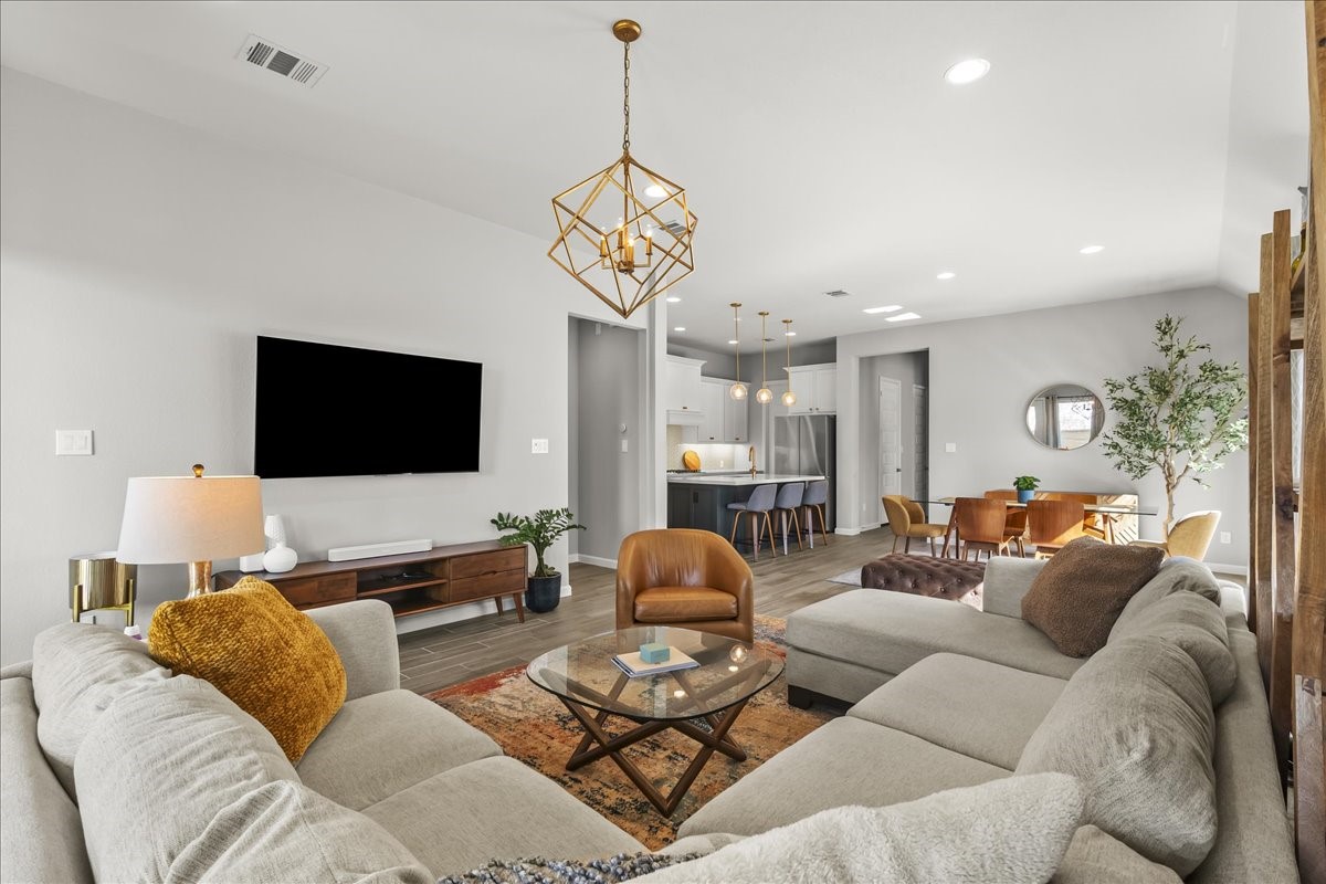 4910 Morrison Drive Manvel, TX 77578 - Photo 8 of 35 a living room with furniture and a flat screen tv