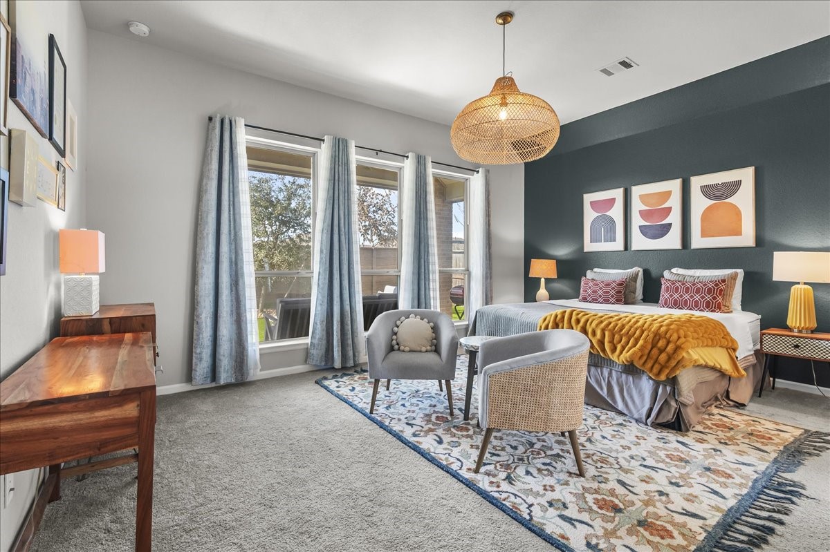 4910 Morrison Drive Manvel, TX 77578 - Photo 9 of 35 a living room with furniture and a chandelier