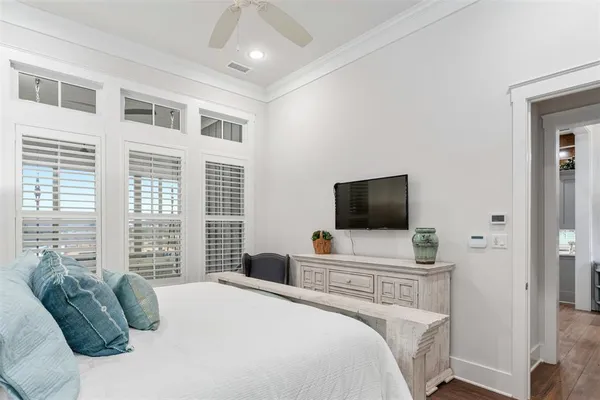 a bedroom with a bed and a television