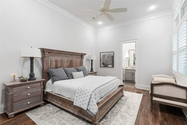 a bedroom with a bed and a night stand