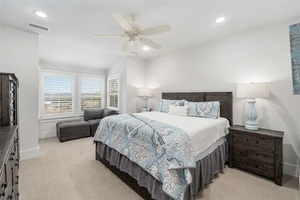 a bed room with a bed and a television