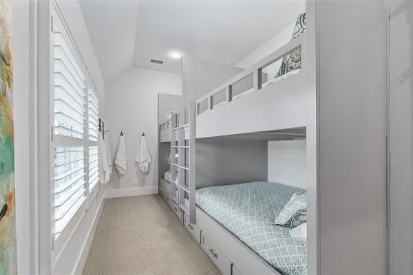 a bedroom with windows