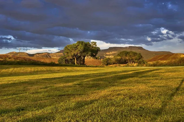 a view of an ocean and a mountain