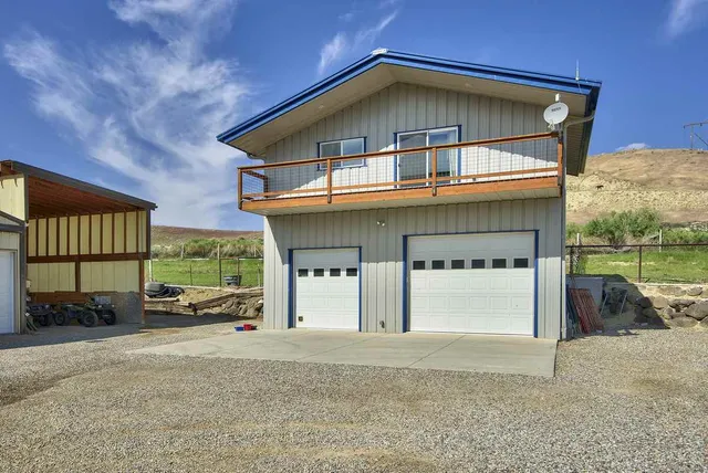 a view of a field with mountains in the background