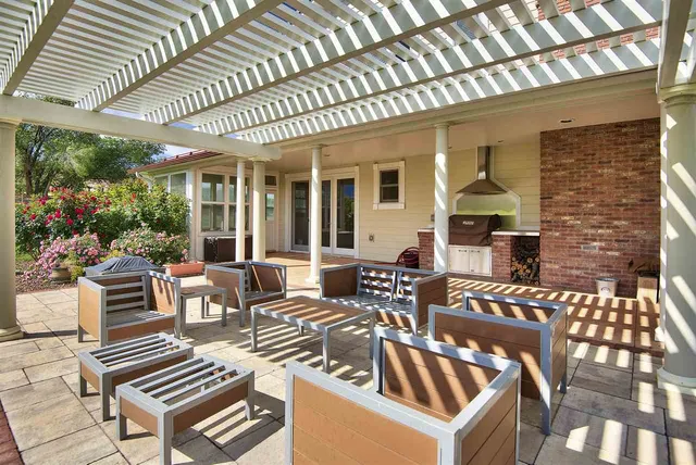 a view of outdoor dining space with a patio