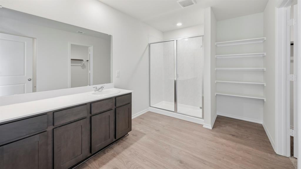 505 Yellow Rose Way Princeton, TX 75407 - Photo 2 of 35 a bathroom with a double vanity sink and mirror