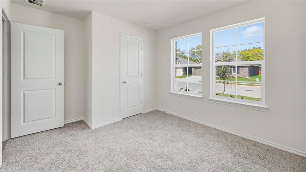 505 Yellow Rose Way Princeton, TX 75407 - Photo 6 of 35 an empty room with windows