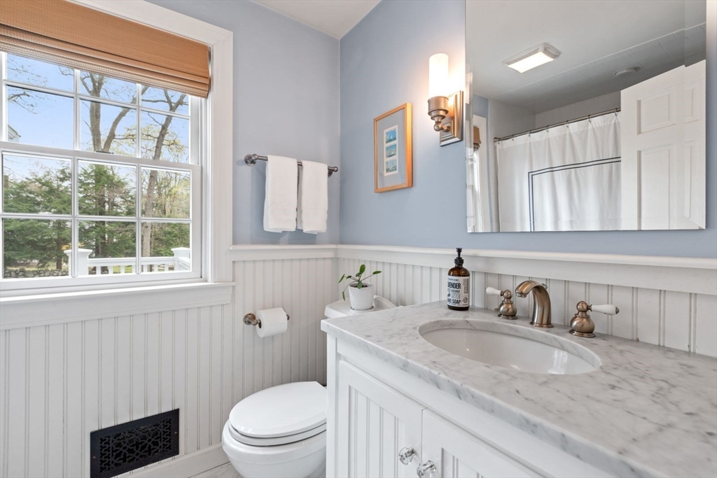 2 Yorkshire Road Dover, MA 02030 - Photo 18 of 42 a bathroom with a granite countertop sink a toilet and a mirror