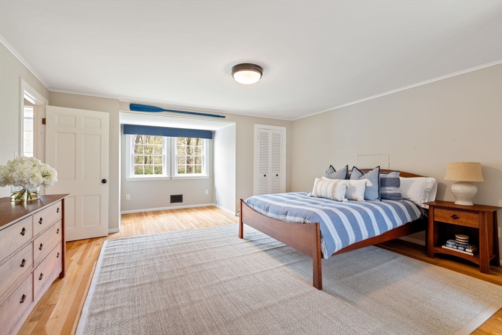 2 Yorkshire Road Dover, MA 02030 - Photo 24 of 42 a spacious bedroom with a bed and a window