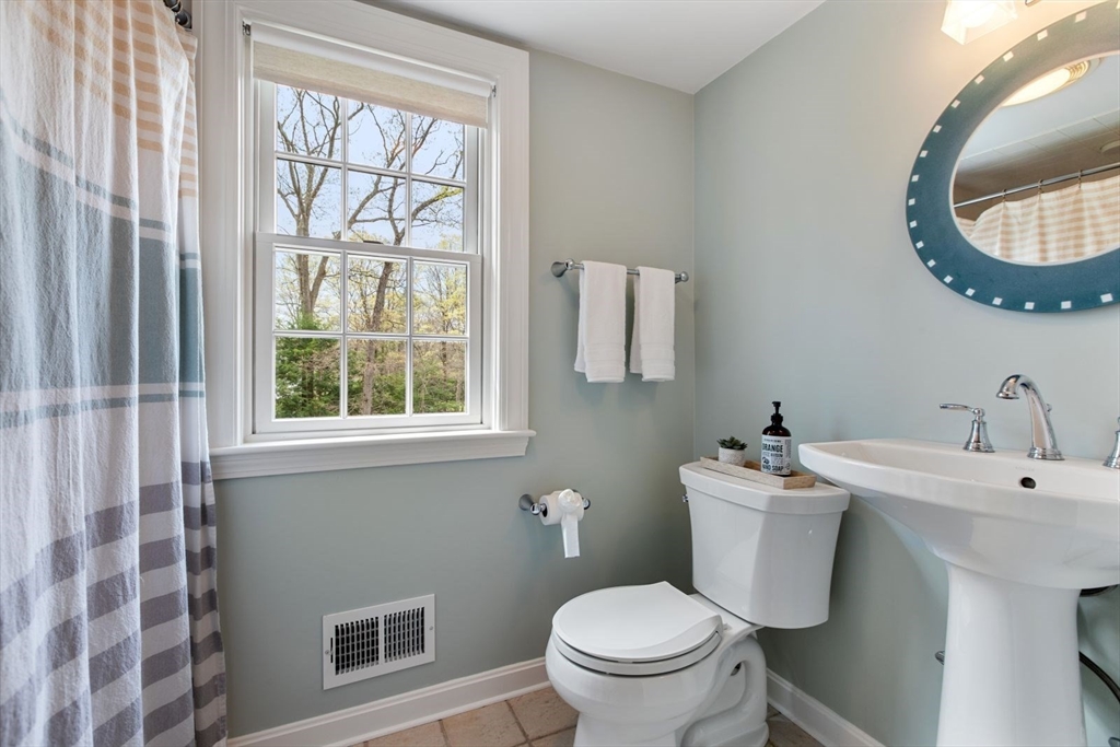 2 Yorkshire Road Dover, MA 02030 - Photo 25 of 42 a bathroom with a toilet sink and mirror