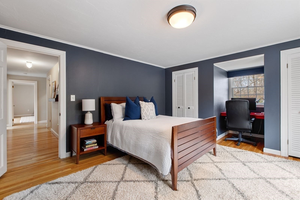 2 Yorkshire Road Dover, MA 02030 - Photo 28 of 42 a bedroom with a bed and a chandelier