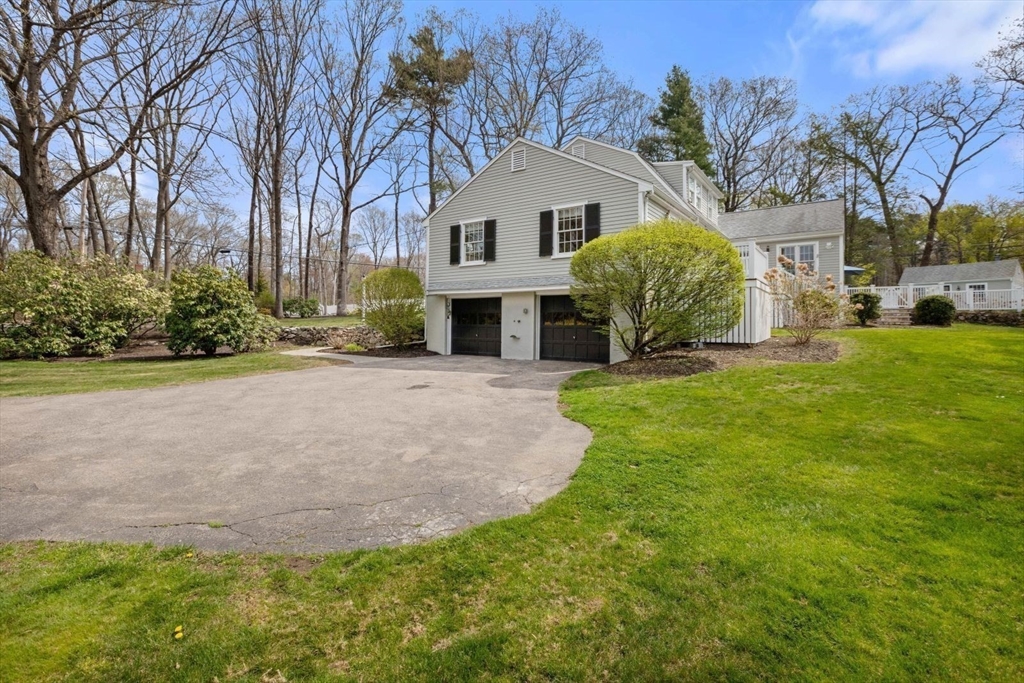 2 Yorkshire Road Dover, MA 02030 - Photo 41 of 42 a front view of a house with a yard and garage