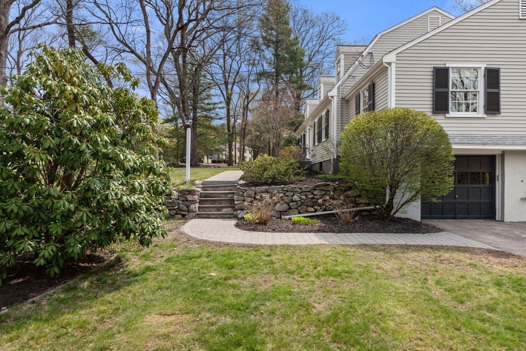 2 Yorkshire Road Dover, MA 02030 - Photo 42 of 42 a view of a backyard with plants and a tree