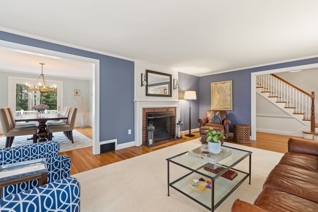 2 Yorkshire Road Dover, MA 02030 - Photo 5 of 42 a living room with furniture a fireplace and a window