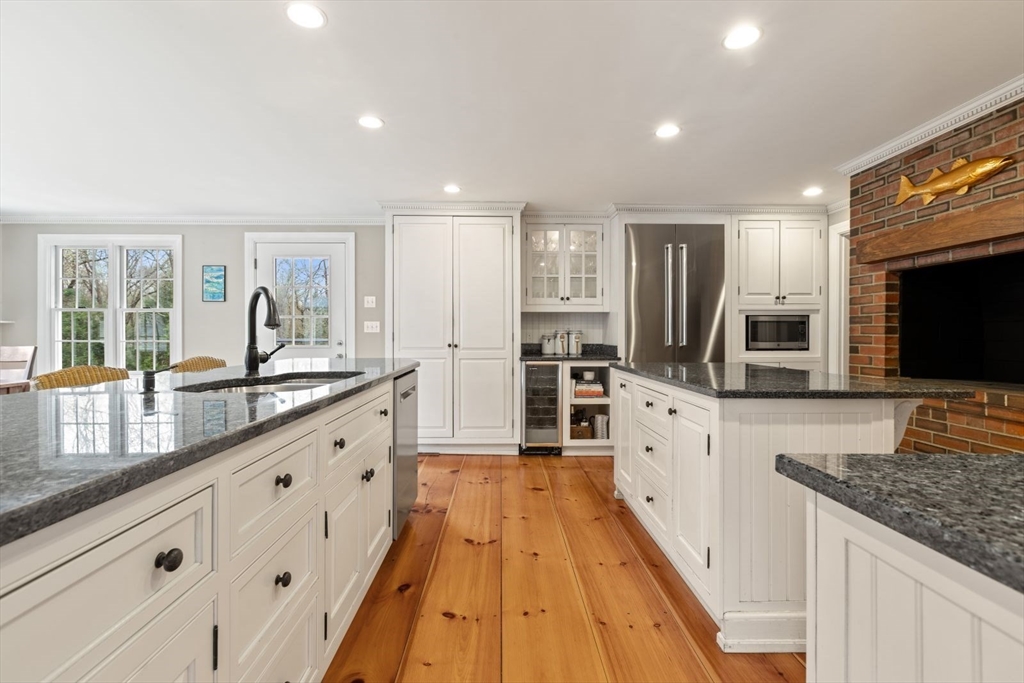 2 Yorkshire Road Dover, MA 02030 - Photo 10 of 42 a large kitchen with granite countertop a large counter top space appliances and cabinets