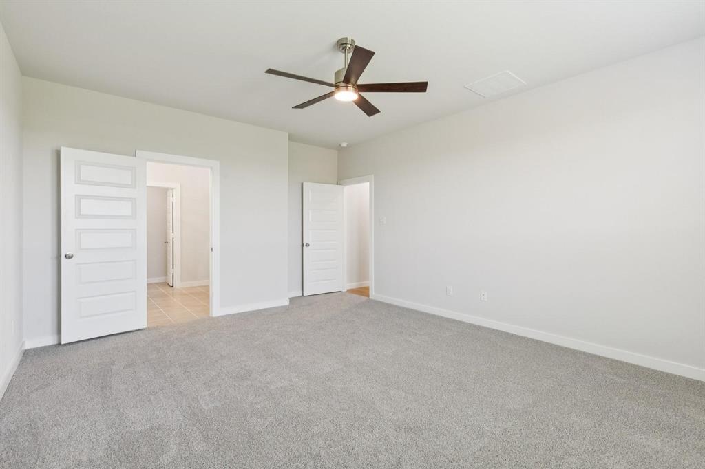 1117 Sunward Road Princeton, TX 75407 - Photo 13 of 34 an empty room with closet and ceiling fan