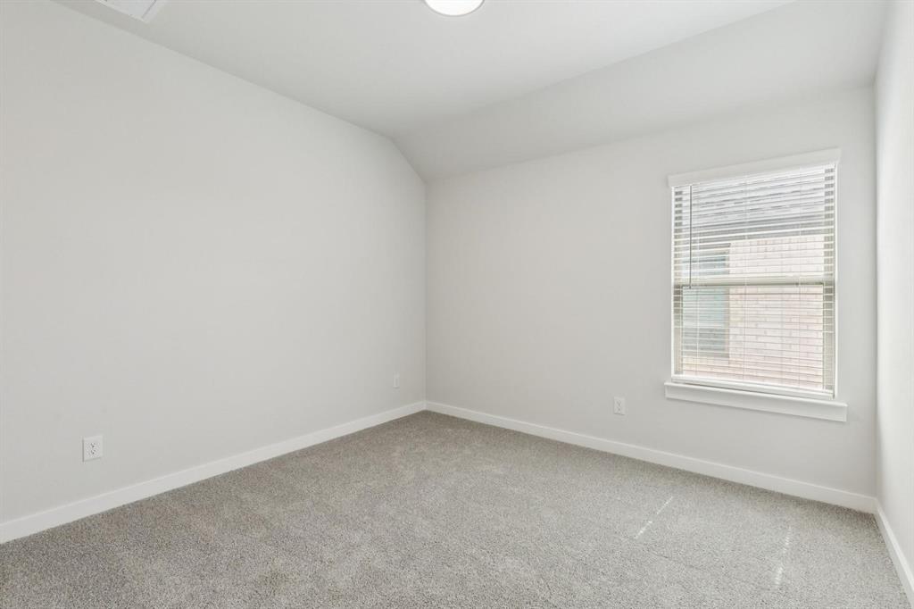 1117 Sunward Road Princeton, TX 75407 - Photo 22 of 34 an empty room with a window