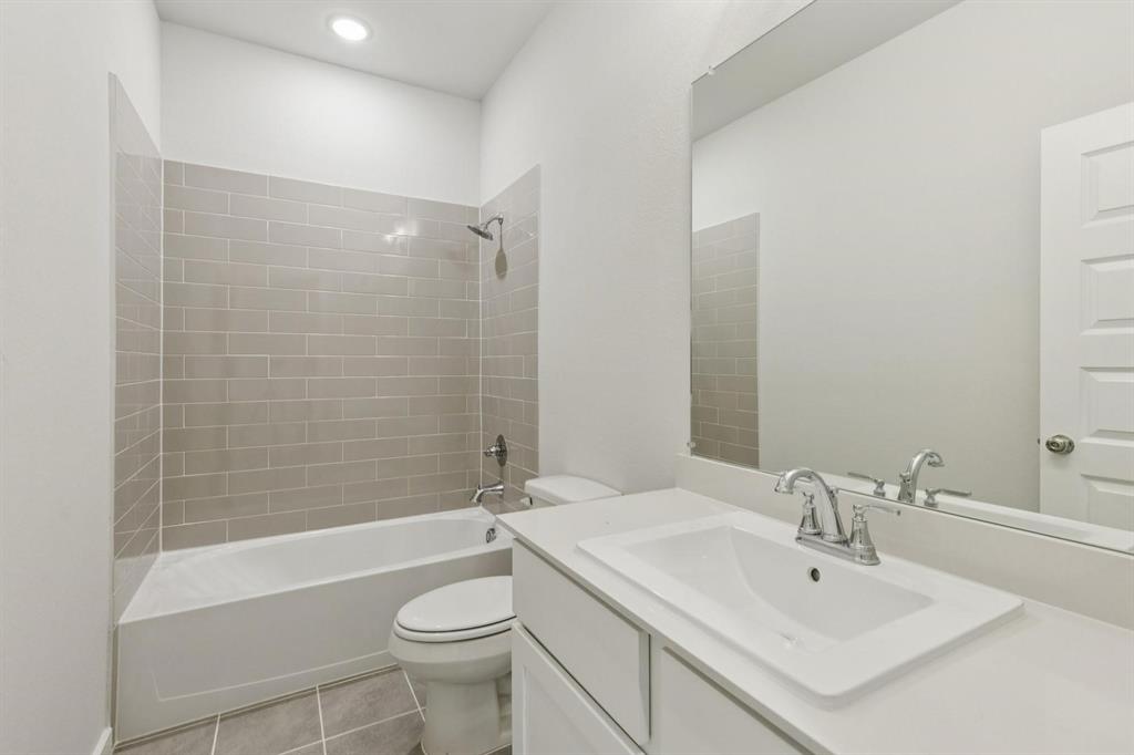 1117 Sunward Road Princeton, TX 75407 - Photo 23 of 34 a bathroom with a sink toilet and shower