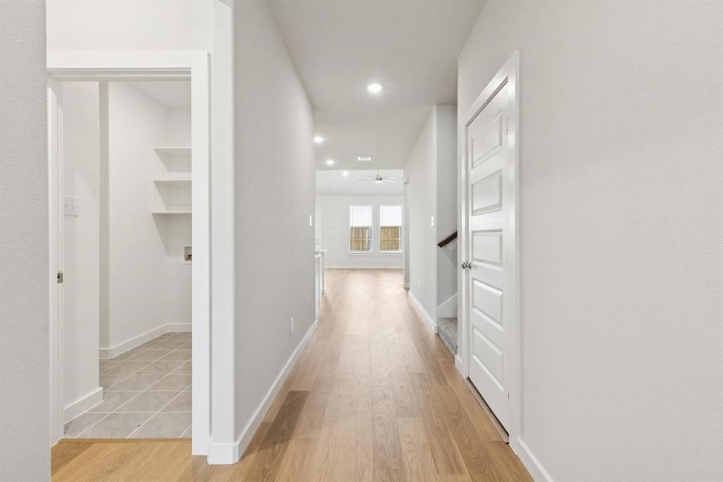 1117 Sunward Road Princeton, TX 75407 - Photo 6 of 34 a view of a hallway with wooden floor