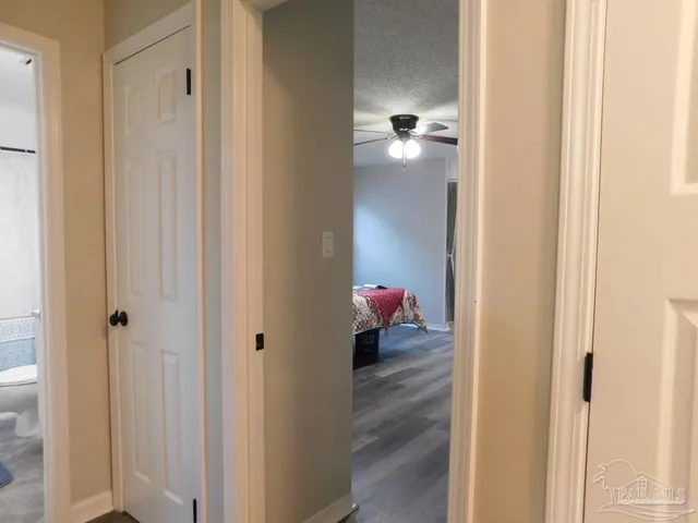 a view of a bathroom from a hallway