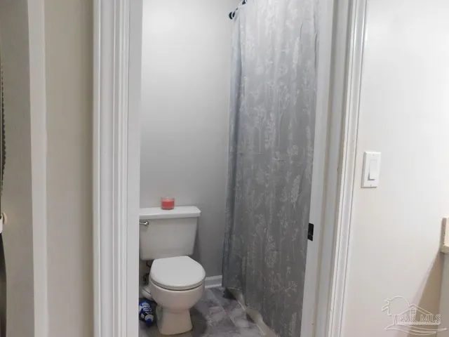 a bathroom with a toilet and a sink