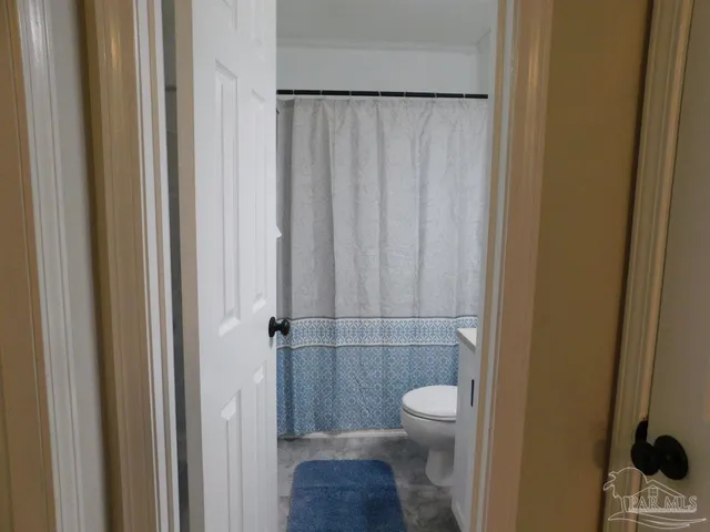 a bathroom with a toilet a sink and a shower