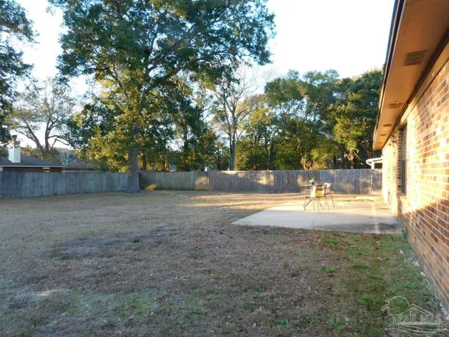 a view of yard with swimming pool