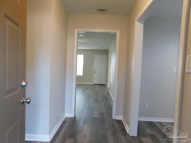 a view of a livingroom from a hallway