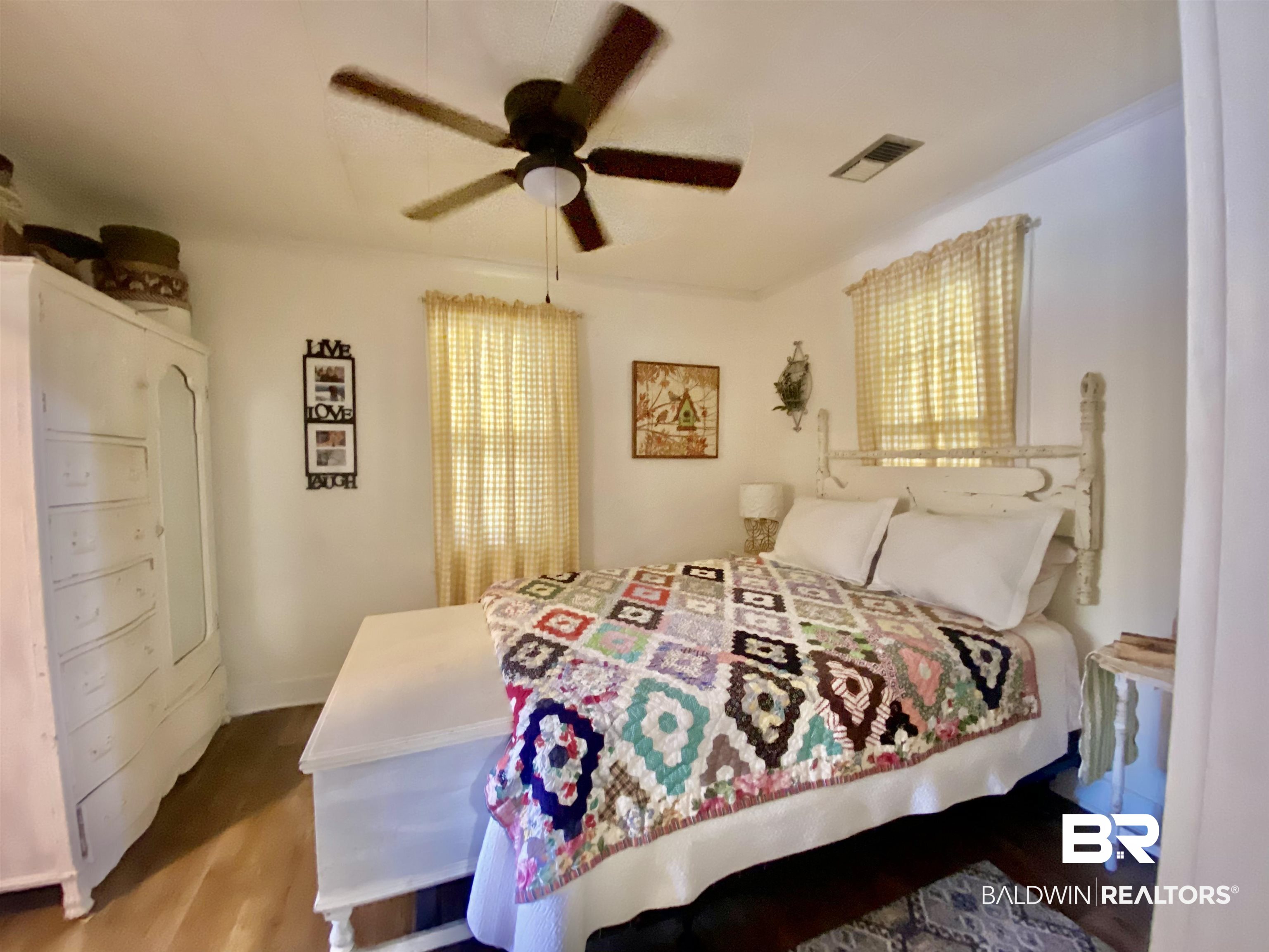 531 Highway 136 Monroeville, AL 36460 - Photo 25 of 48 Bedroom with multiple windows, wood-type flooring, and ceiling fan