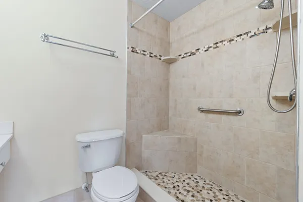 a bathroom with a glass shower door