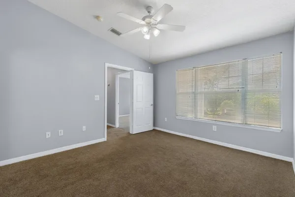 a view of storage and utility room with dryer and washer