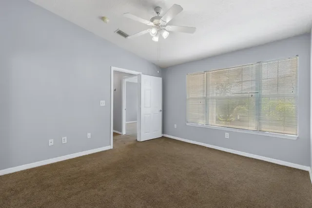 a view of storage and utility room with dryer and washer