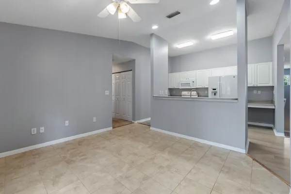 a view of a kitchen with a sink and a stove top oven