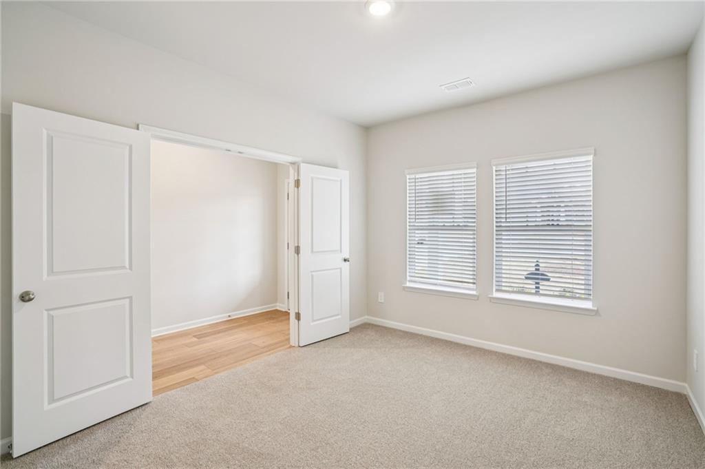 6939 Winchester Place Fairburn, GA 30213 - Photo 20 of 56 a view of an empty room with a window