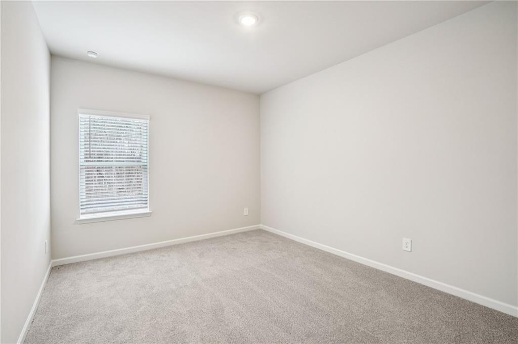 6939 Winchester Place Fairburn, GA 30213 - Photo 23 of 56 an empty room with a window