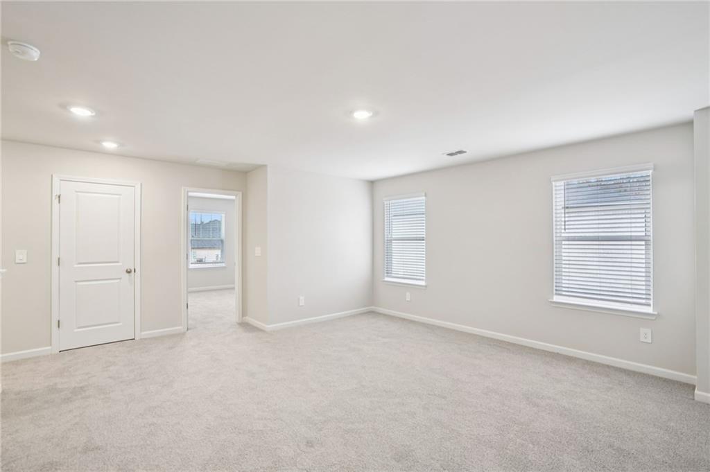 6939 Winchester Place Fairburn, GA 30213 - Photo 26 of 56 a view of an empty room with a window
