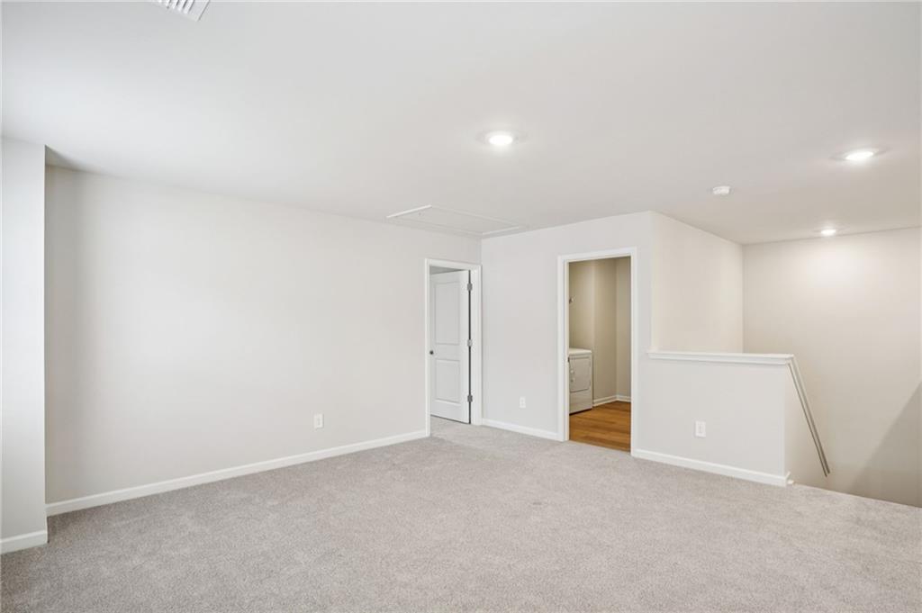 6939 Winchester Place Fairburn, GA 30213 - Photo 27 of 56 a view of an empty room
