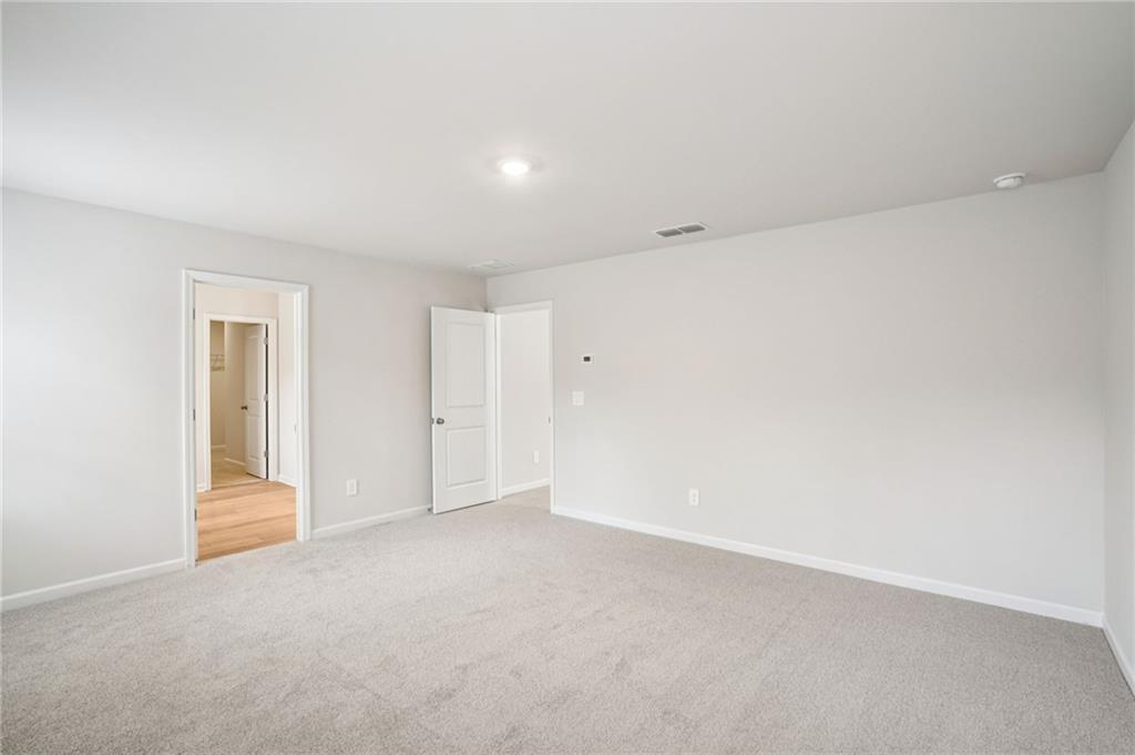 6939 Winchester Place Fairburn, GA 30213 - Photo 31 of 56 a view of an empty room